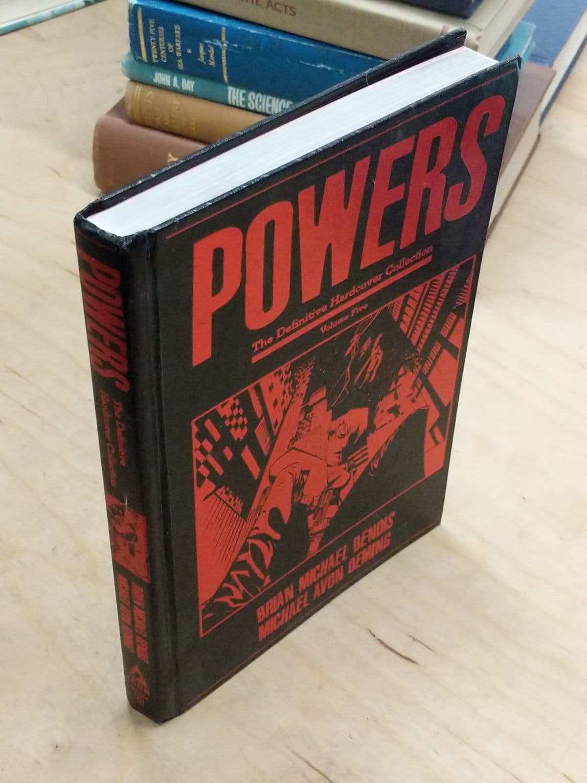 Powers: The Definitive Hardcover Collection, Volume Five by Brian Michael Bendis, Michael Avon Oeming - quarter view showing binding condition