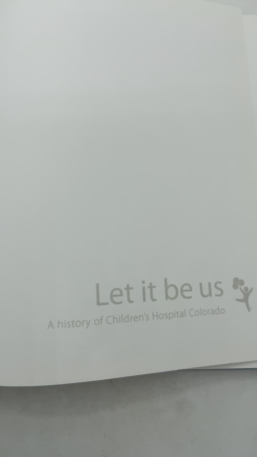 Let it be us: A history of Children's Hospital Colorado by Elizabeth Costello, Michelle Fulcher, and Sandy Graham - title page