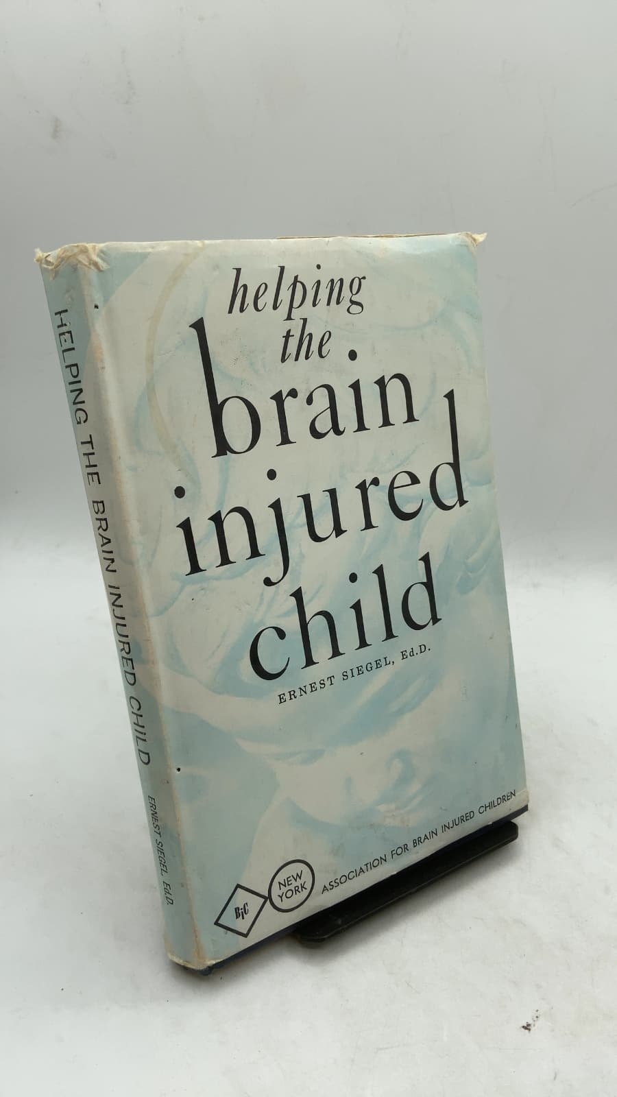 Helping the Brain Injured Child by Ernest Siegel, Ed.D. - front cover