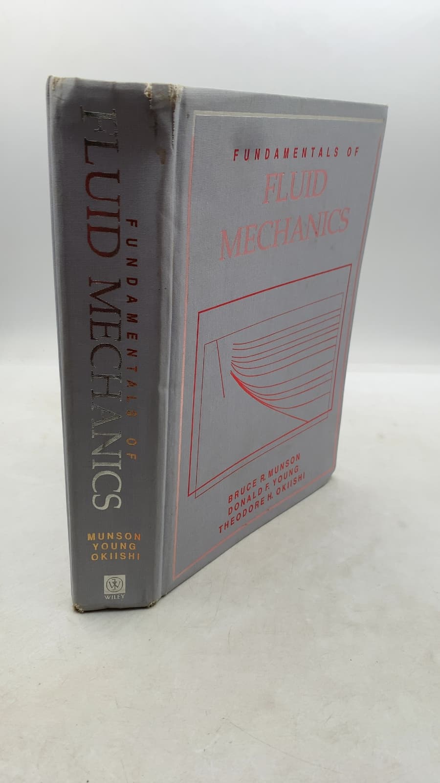 Fundamentals of Fluid Mechanics by Bruce R. Munson, Donald F. Young, Theodore H. Okiishi - front cover