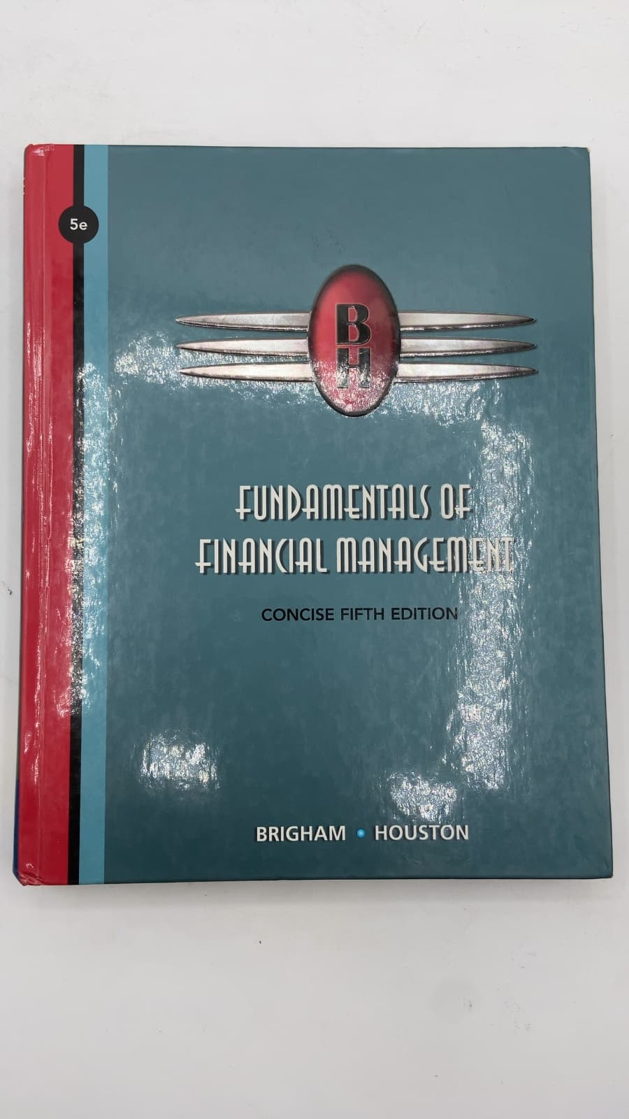Fundamentals of Financial Management: Concise Fifth Edition by Eugene F. Brigham and Joel F. Houston - quarter view showing binding condition