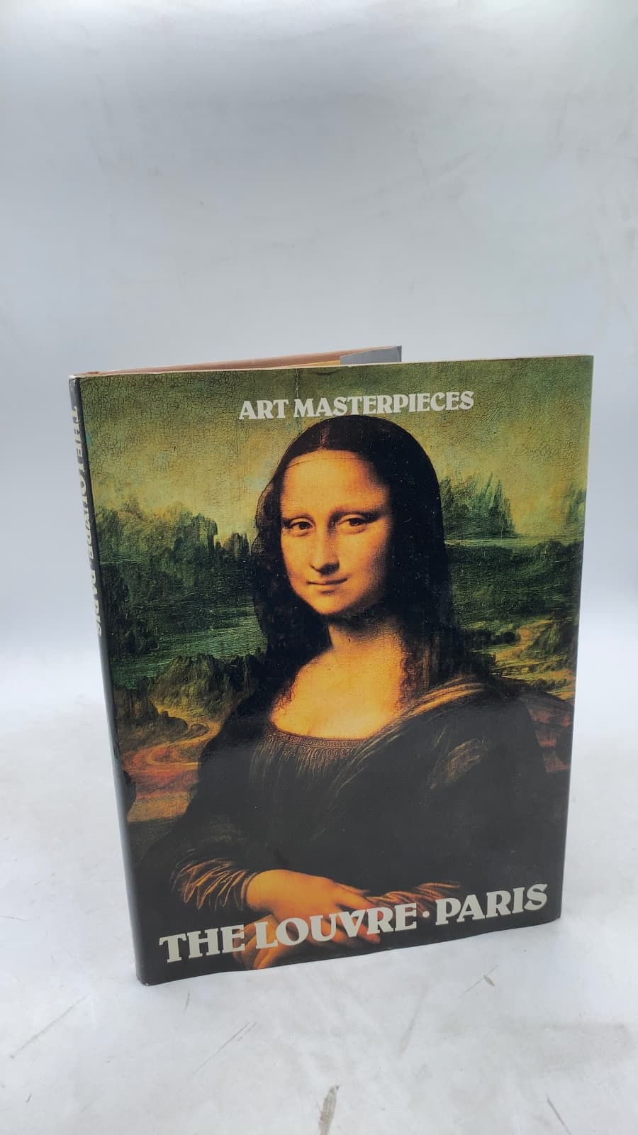 Art Masterpieces of The Louvre by Ted Smart and David Gibbon - front cover