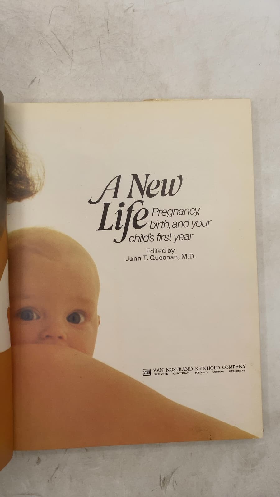 A New Life: Pregnancy, birth, and your child's first year by John T. Queenan, M.D. - title page