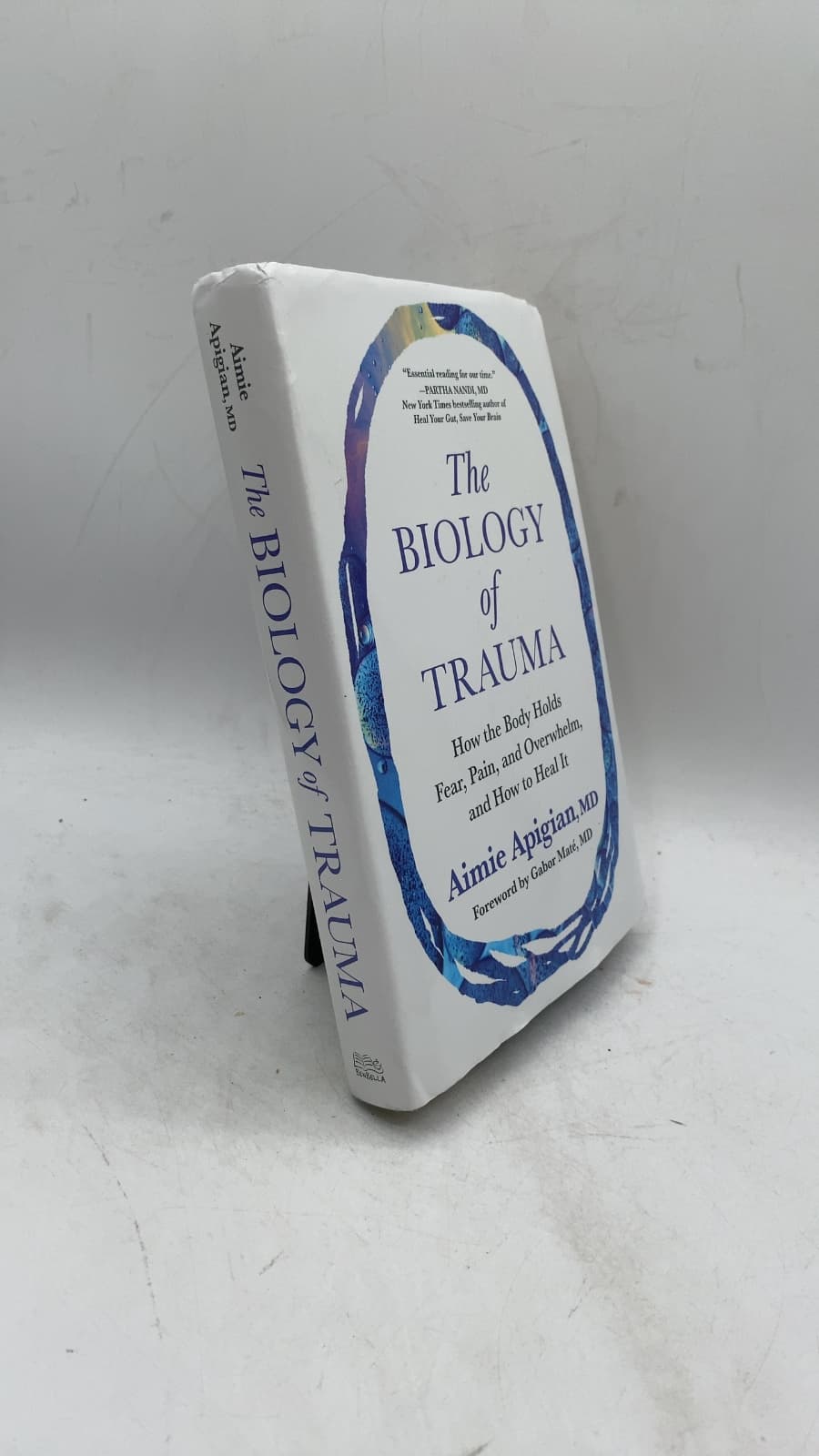 The Biology of Trauma: How the Body Holds Fear, Pain, and Overwhelm, and How to Heal It by Aimie Apigian, MD - front cover