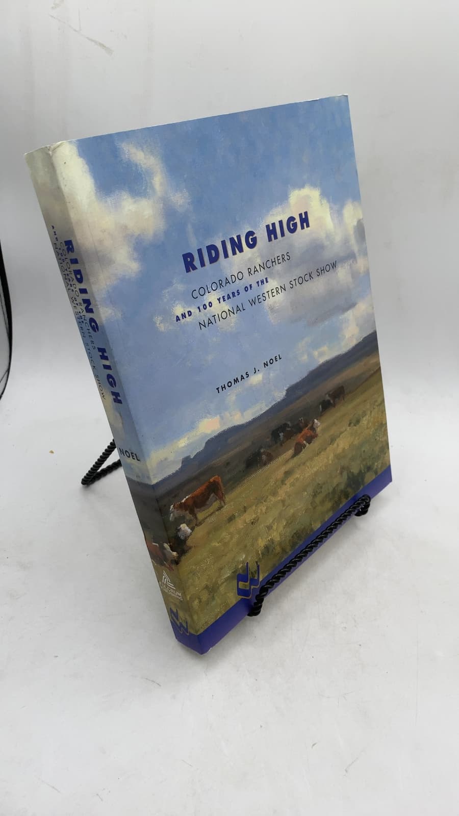 Riding High: Colorado Ranchers and 100 Years of the National Western Stock Show by Thomas J. Noel - front cover