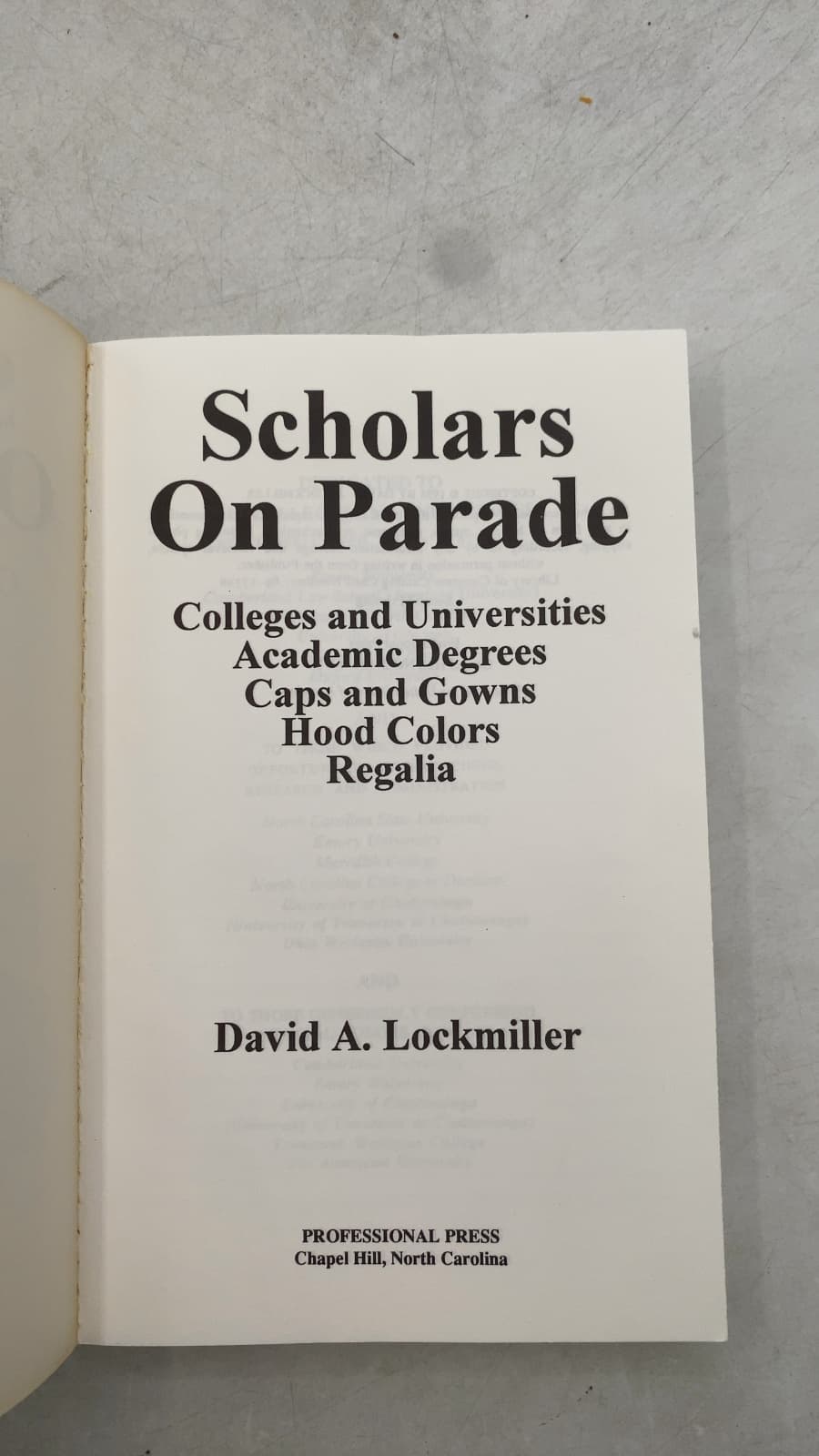 Scholars On Parade: Colleges and Universities, Academic Degrees, Caps and Gowns, Hood Colors, Regalia by David A. Lockmiller - title page