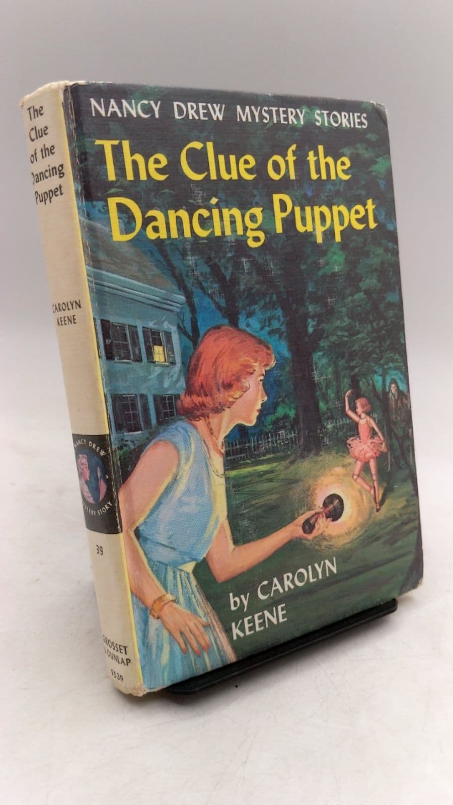 The Clue of the Dancing Puppet by Carolyn Keene - front cover
