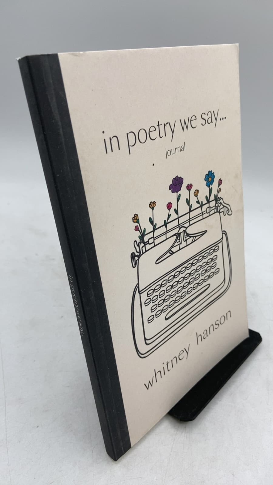 in poetry we say... journal by Whitney Hanson - front cover