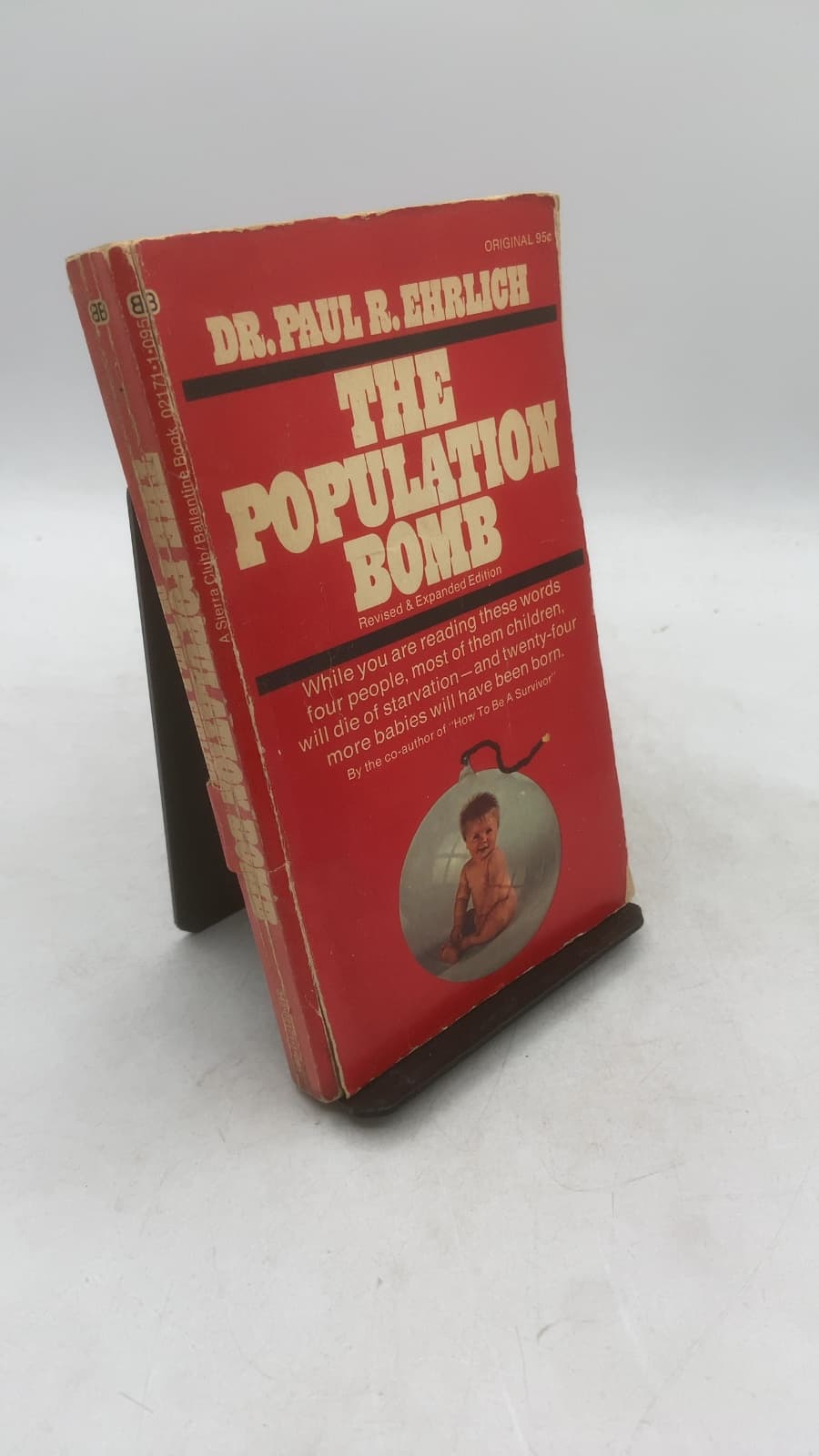 The Population Bomb (Revised) by Dr. Paul R. Ehrlich - front cover