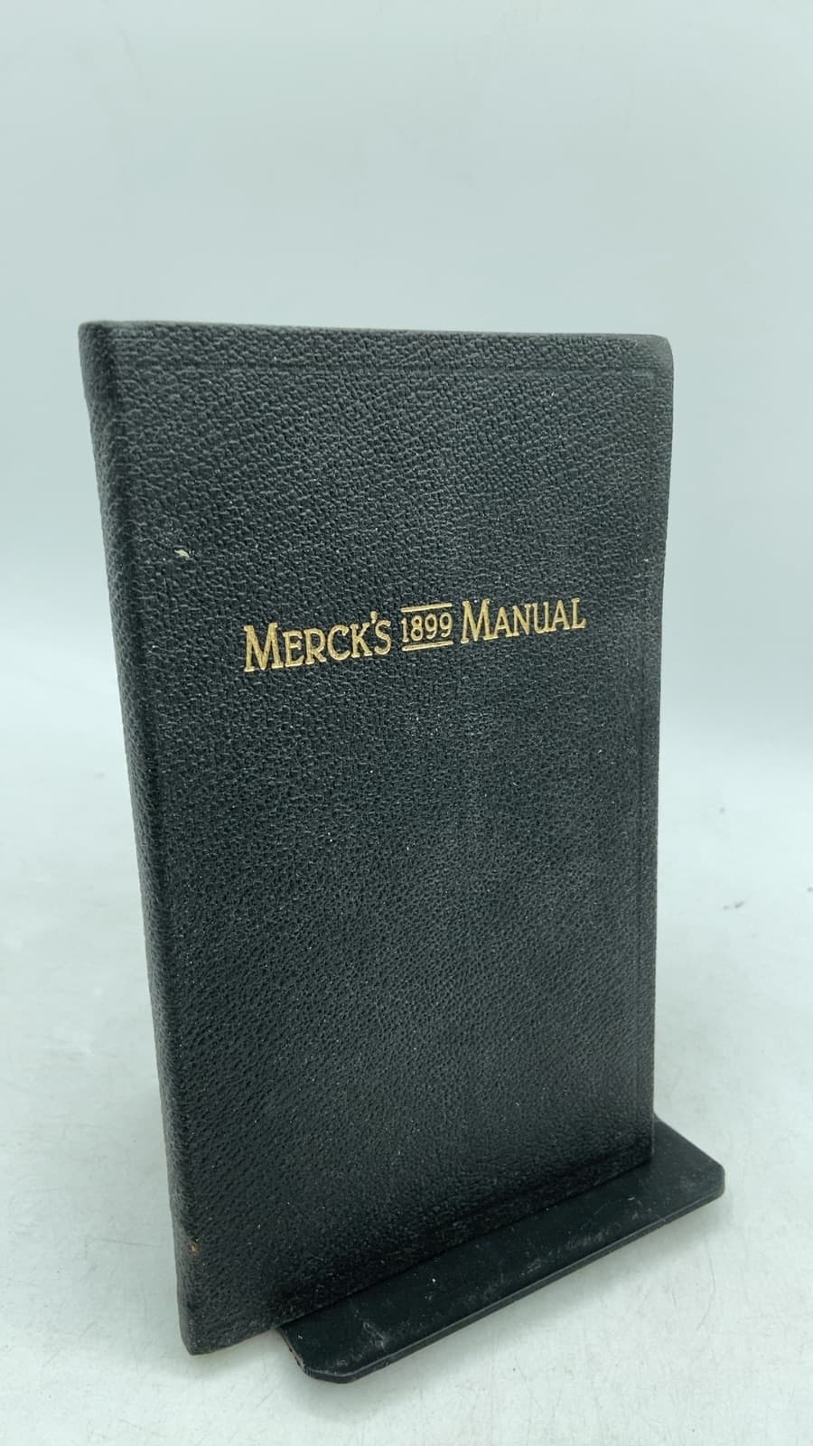Merck's 1899 Manual of the Materia Medica by Merck & Co. - front cover