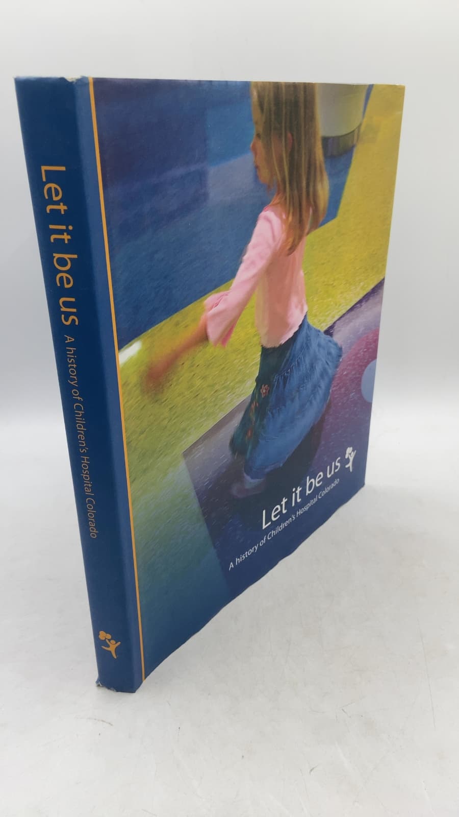 Let it be us: A history of Children's Hospital Colorado by Elizabeth Costello, Michelle Fulcher, and Sandy Graham - front cover