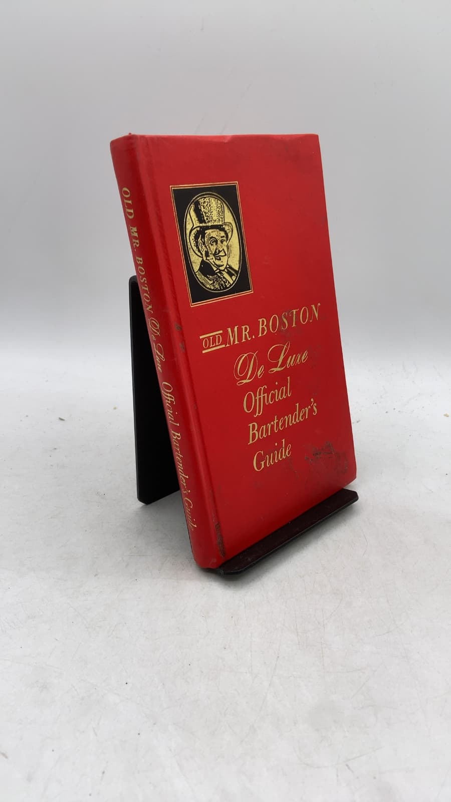 Old Mr. Boston De Luxe Official Bartender's Guide by Leo Cotton - front cover
