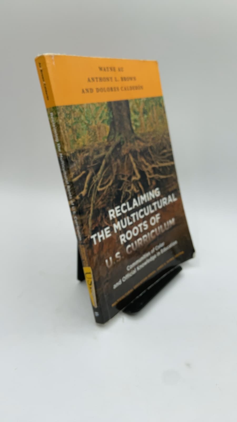 Reclaiming the Multicultural Roots of U.S. Curriculum: Communities of Color and Official Knowledge in Education by Wayne Au, Anthony L. Brown, and Dolores Calderón - front cover