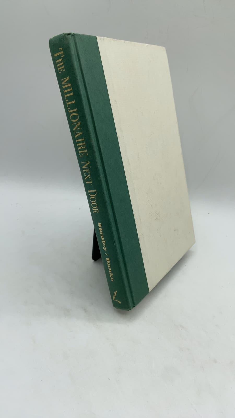 The Millionaire Next Door: The Surprising Secrets of America's Wealthy by Thomas J. Stanley, Ph.D. and William D. Danko, Ph.D. - front cover