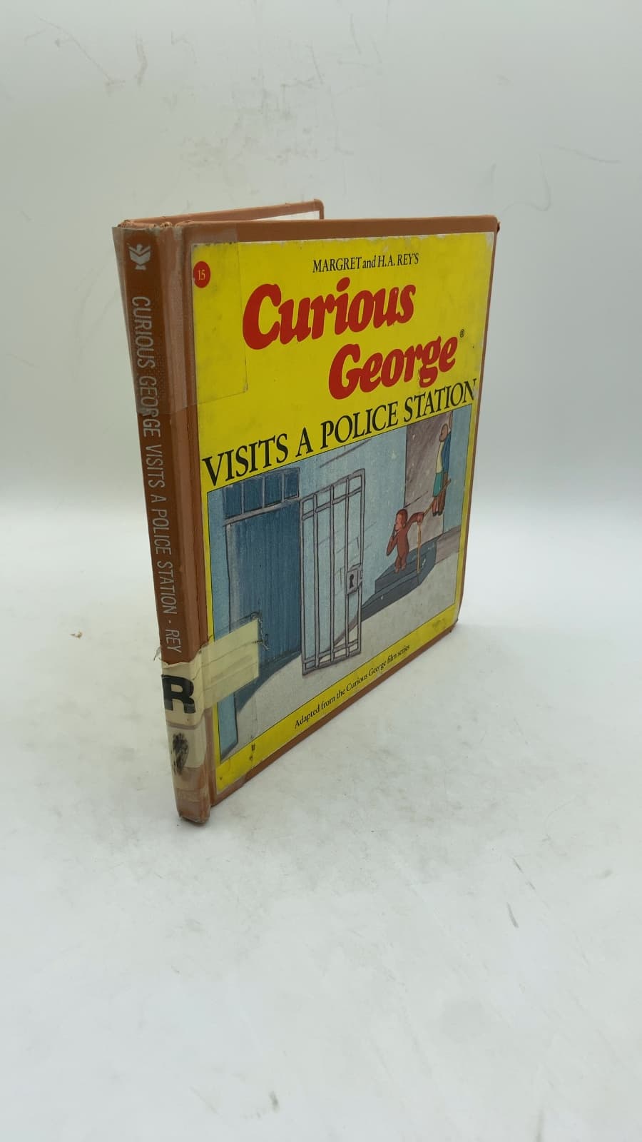 Curious George Visits a Police Station by Margret Rey and Alan J. Shalleck - front cover