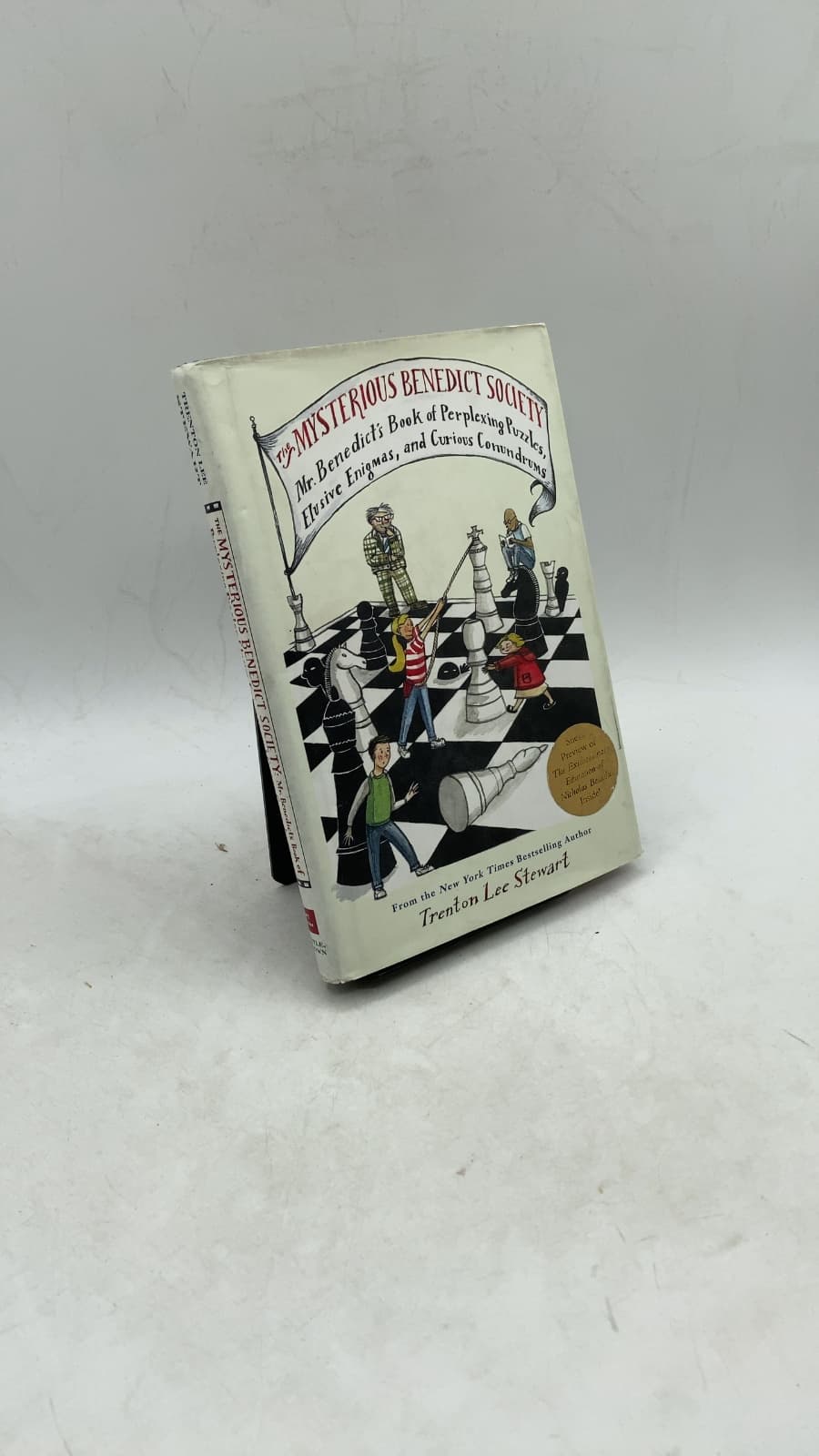 The Mysterious Benedict Society: Mr. Benedict's Book of Perplexing Puzzles, Elusive Enigmas, and Curious Conundrums by Trenton Lee Stewart - front cover