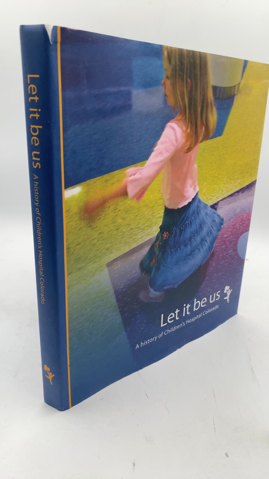 Let it be us: A history of Children's Hospital Colorado by Elizabeth Costello, Michelle Fulcher, Sandy Graham - front cover