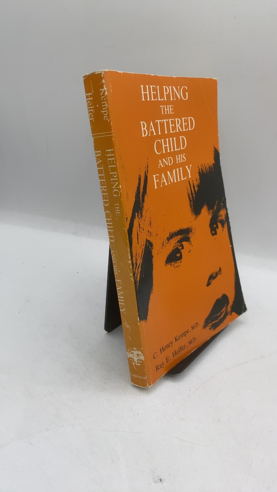 Helping THE Battered Child AND HIS Family by C. Henry Kempe, M.D. and Ray E. Helfer, M.D. - front cover
