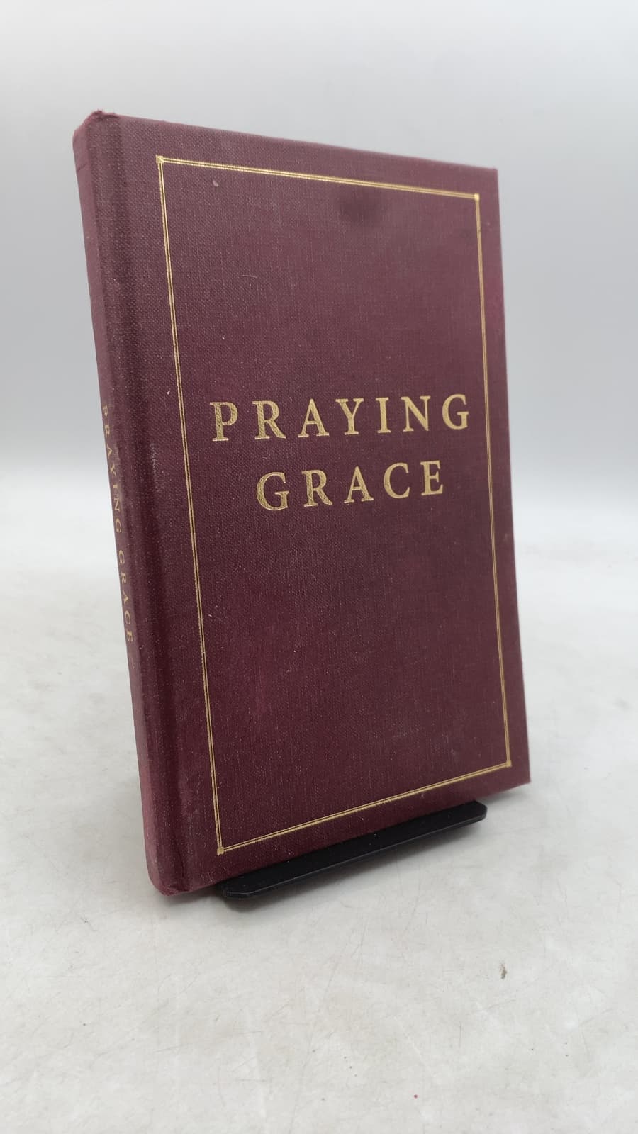 Praying Grace: 55 Meditations & Prayers for Receiving God's Unmerited Favor by Matt and Laurie Crouch - front cover