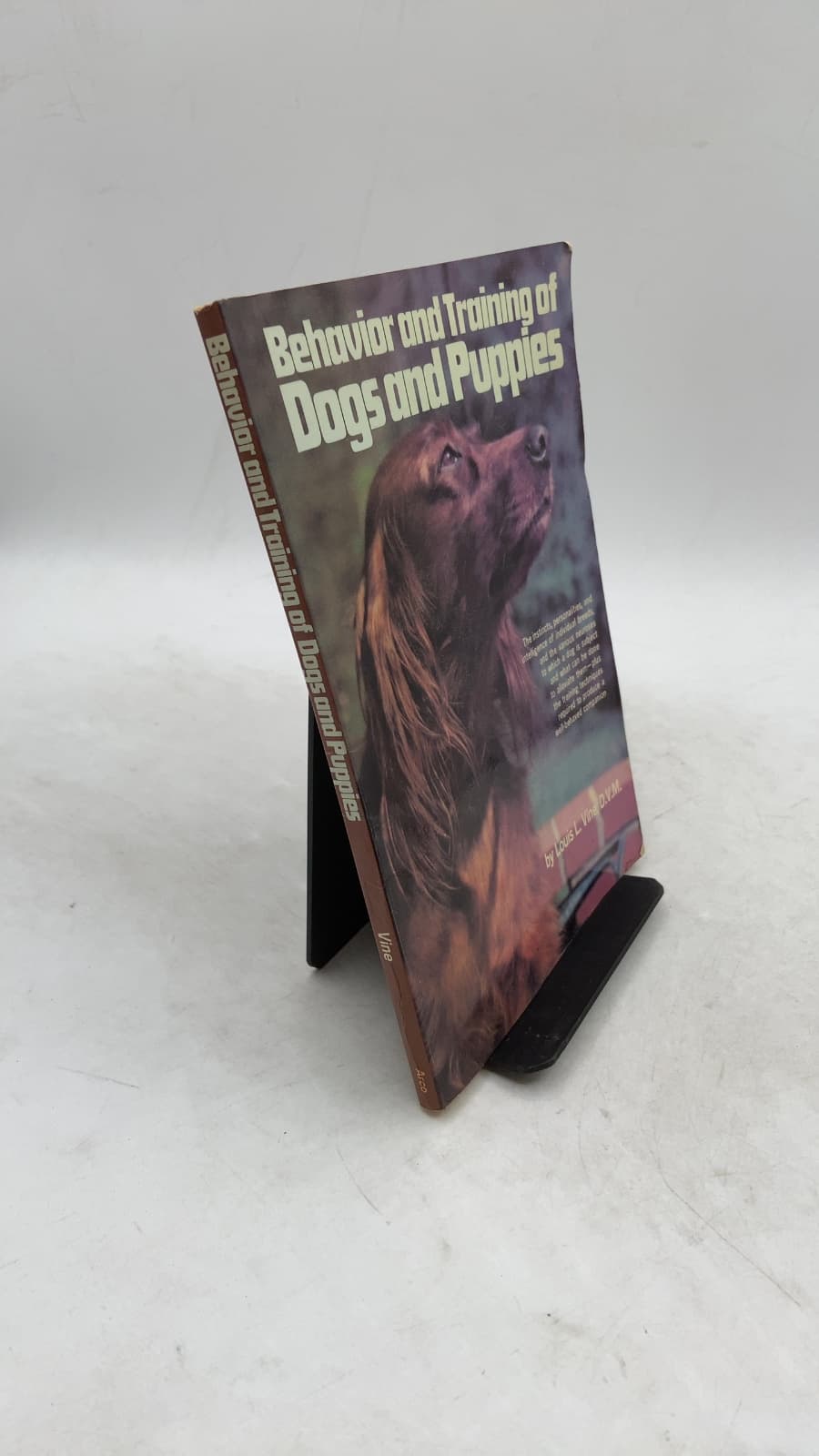 Behavior and Training of Dogs and Puppies by Louis L. Vine, D.V.M. - front cover