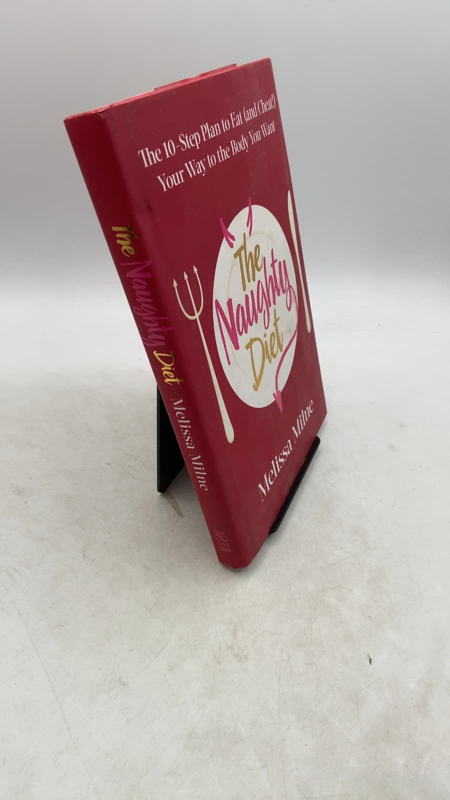 The Naughty Diet: The 10-Step Plan to Eat and Cheat Your Way to the Body You Want by Melissa Milne - front cover