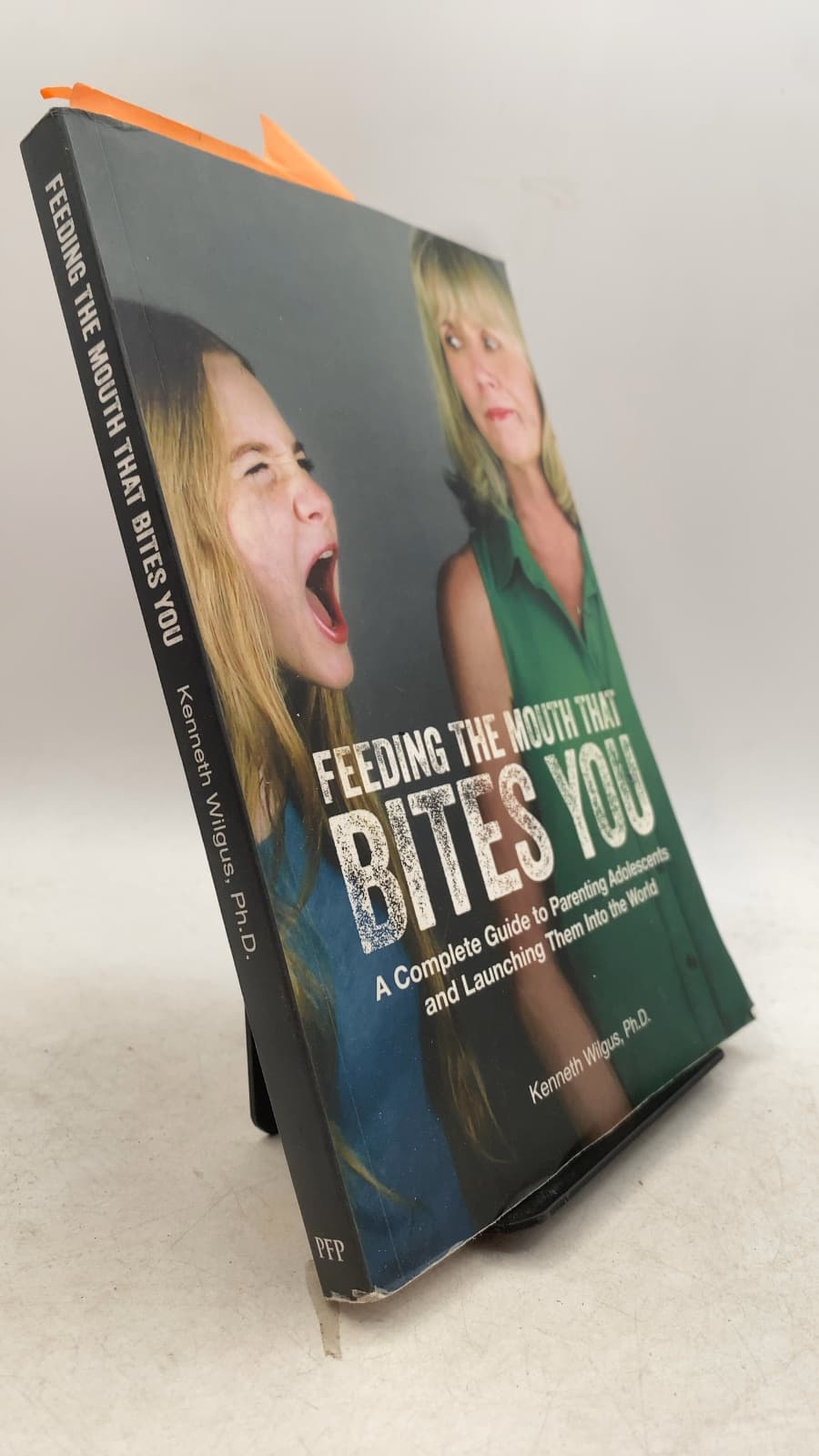 Feeding the Mouth That Bites You: A Complete Guide to Parenting Adolescents and Launching Them Into the World by Kenneth Wilgus, Ph.D. - front cover