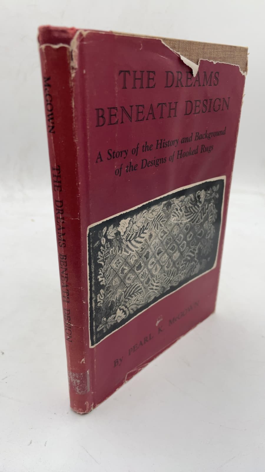 The Dreams Beneath Design: A Story of the History and Background of the Designs of Hooked Rugs by Pearl K. Mcgown - front cover