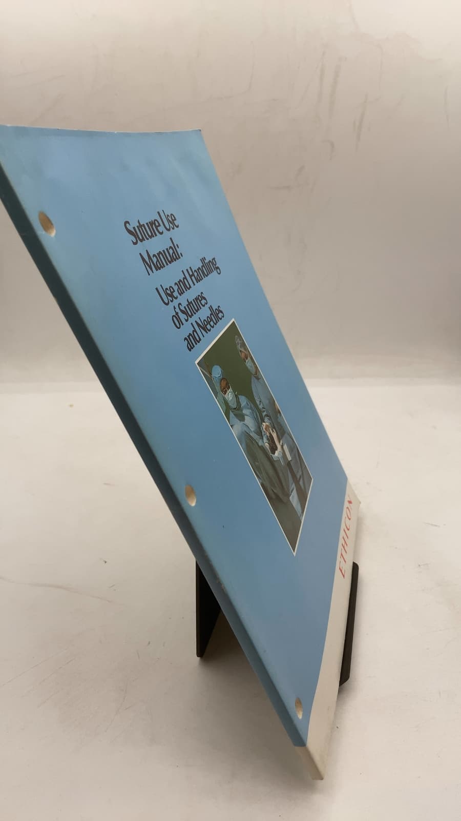 Suture Use Manual: Use and Handling of Sutures and Needles - front cover