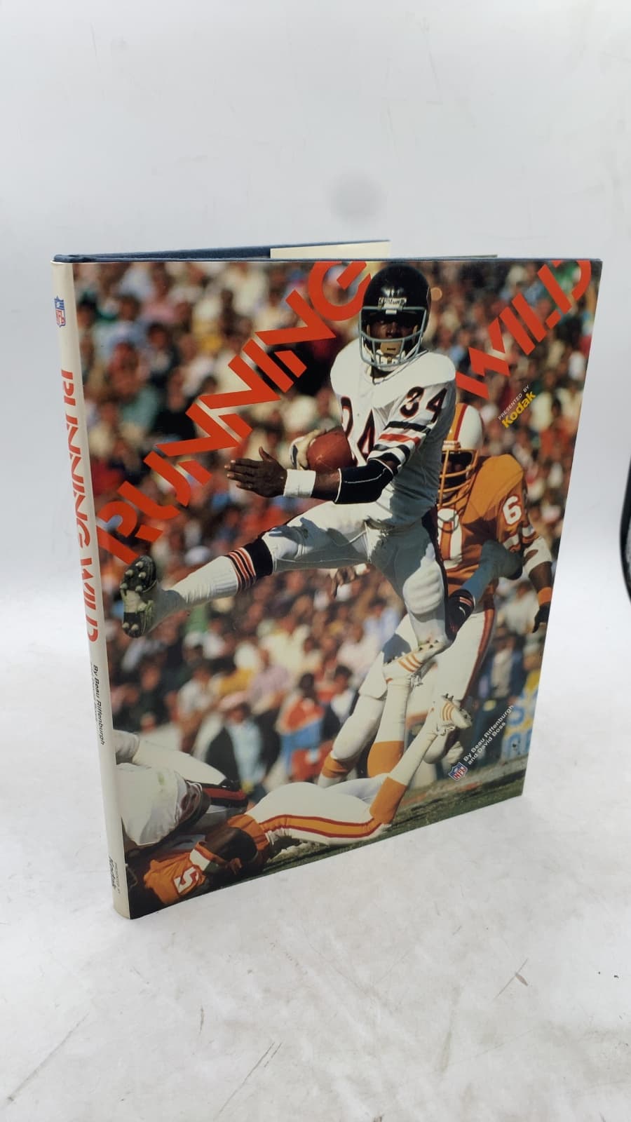 Running Wild: A Pictorial Tribute to the NFL's Greatest Runners by Beau Riffenburgh and David Boss - front cover