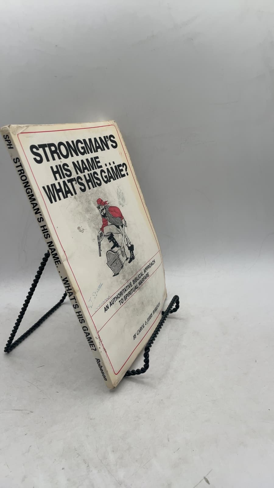Strongman's His Name... What's His Game? by Carol & Jerry Robeson - front cover