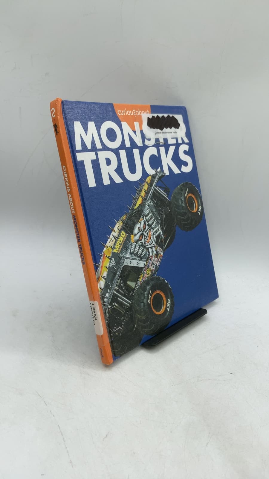 Curious About Monster Trucks by Rachel A. Koestler-Grack - front cover