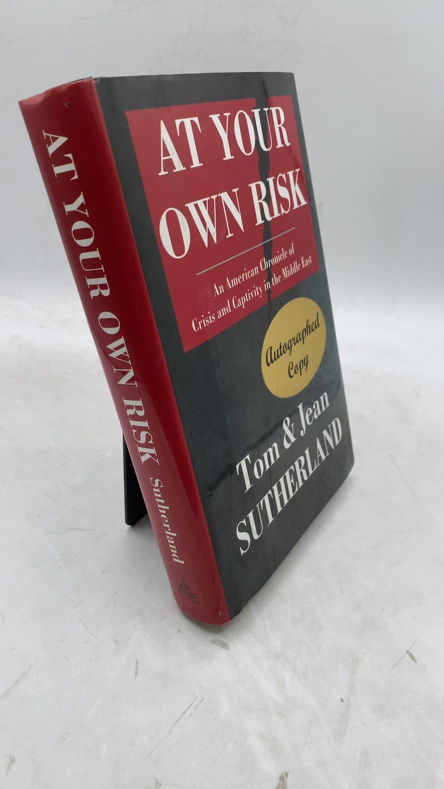 At Your Own Risk: An American Chronicle of Crisis and Captivity in the Middle East by Tom and Jean Sutherland - front cover