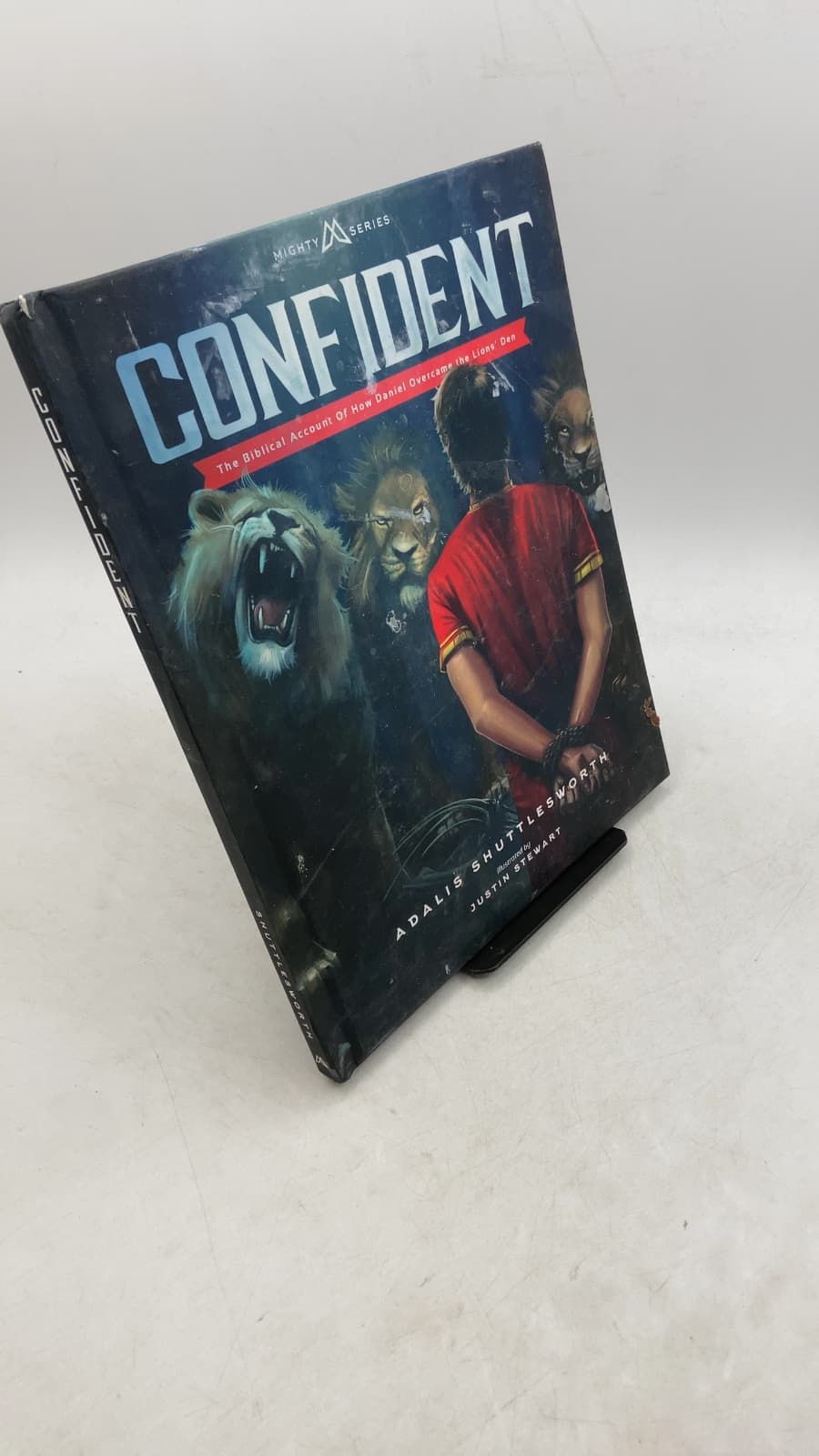 Confident: The Biblical Account of How Daniel Overcame the Lions' Den by Adalis Shuttlesworth - front cover