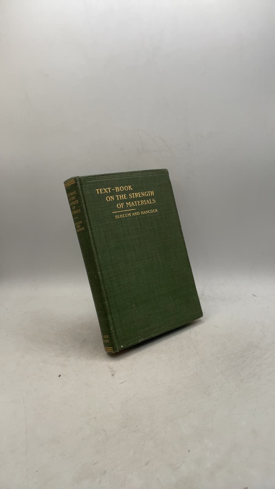 Text-Book ON THE Strength OF Materials by S. E. Slocum, B.E., Ph.D. and E. L. Hancock, M.S. - front cover