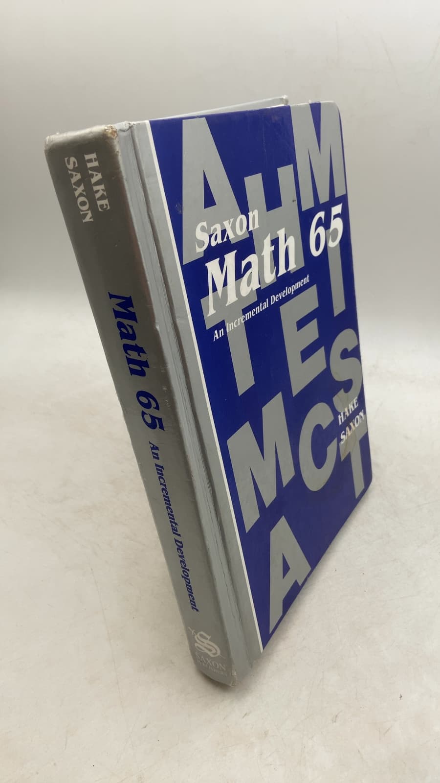 Math 65: An Incremental Development by Stephen Hake and John Saxon - front cover