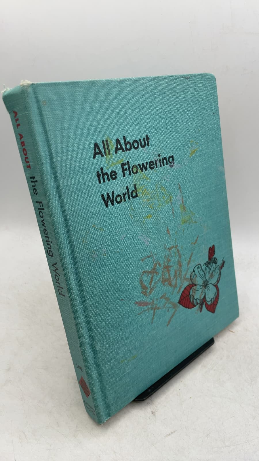 All About the Flowering World by Ferdinand C. Lane - front cover