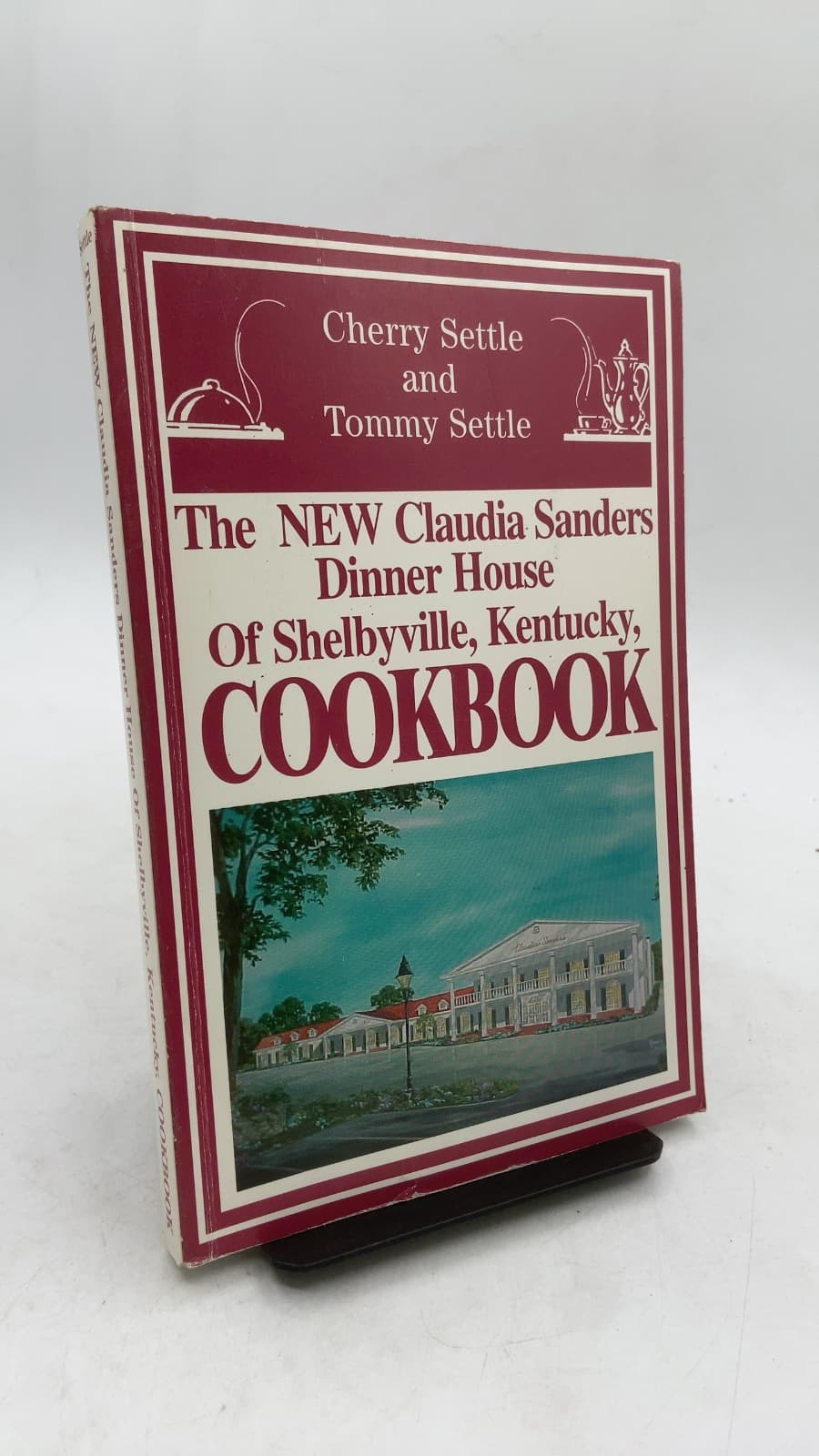 The NEW Claudia Sanders Dinner House of Shelbyville, Kentucky, COOKBOOK by Cherry Settle and Tommy Settle - front cover